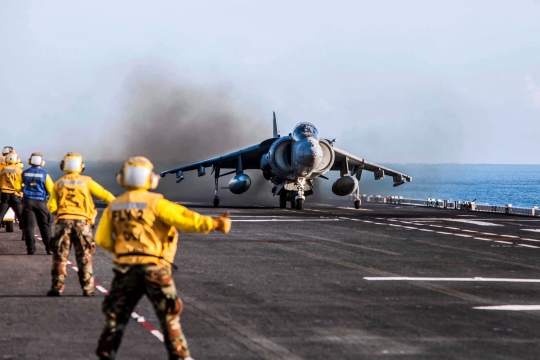 U.S. Navy Aviation Boatswain's Mates give the thumbs-up signal to take off to an AV-8 Harrier assigned to Marine Attack Squadron 311, 31st Marine Expeditionary Unit, during exercise Talisman Sabre 2015 aboard the USS Bonhomme Richard Expeditionary (LHD 6), at sea, Australia, July 11, 2015. Talisman Sabre is a major bilateral exercise that demonstrates the strong Australian-U.S. alliance and military relationship. (U.S. Marine Corps photo by GySgt Ismael Pena/released)